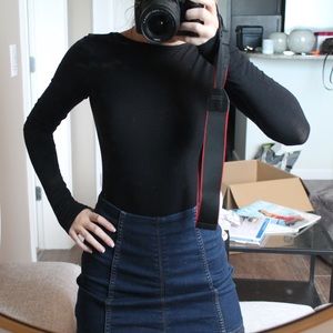 Open back black long sleeve bodysuit.